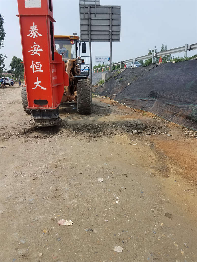 Rapid impact compaction equipment in road shoulder construction